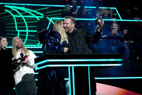 bebe-rexha-ad-david-guett-accept-an-award-onstage-during-the-mtv-europe-music-awards-2022.jpg